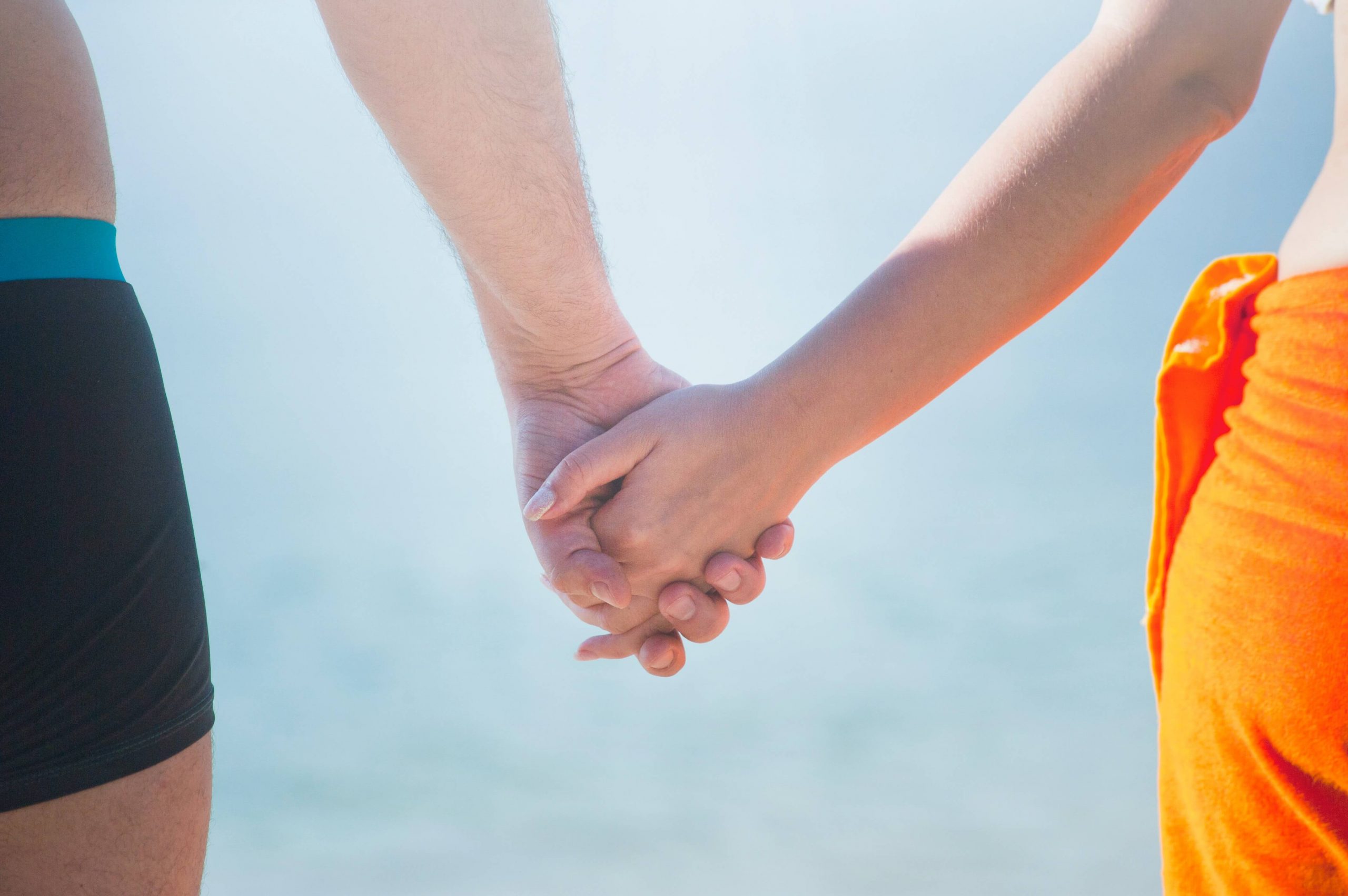 Two people holding hands